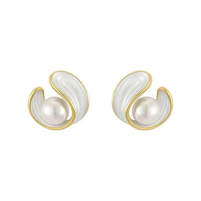 Luxurious earrings featuring white opal and pearl set in gold Jula Jewelry