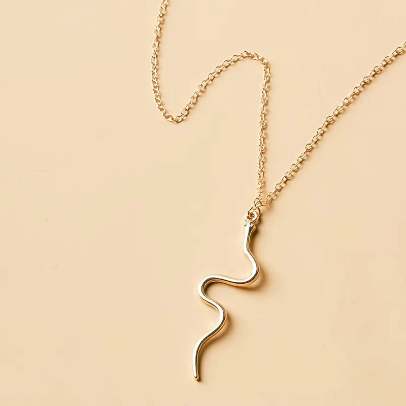 Minimalist necklace featuring a serpentine pattern. Jula Jewelry