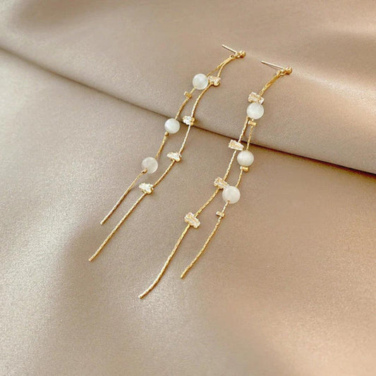 Elegant dangling earrings adorned with pearls and cubic zirconia Jula Jewelry