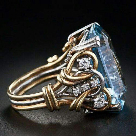 Gold ring featuring a vintage-style blue zircon. Jula Jewelry