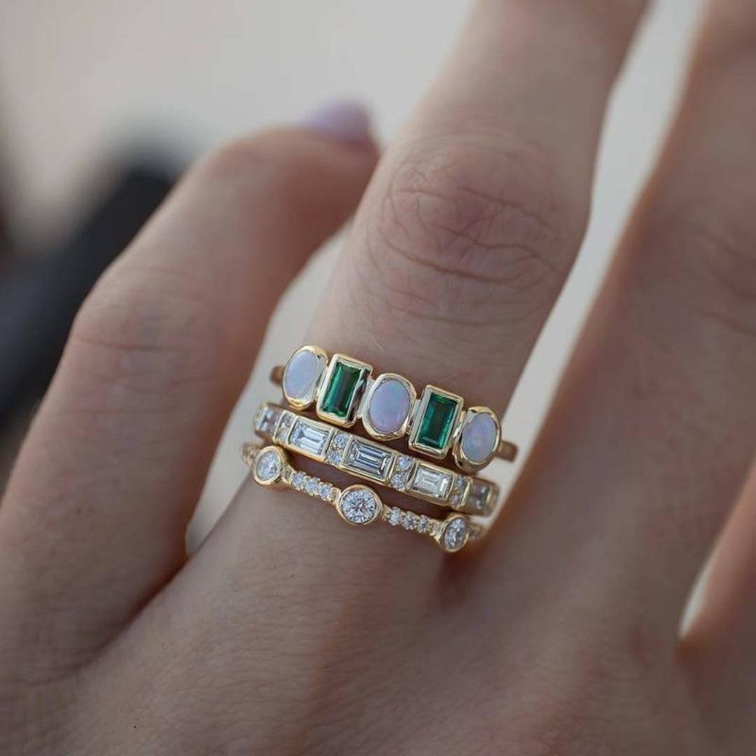 Vintage rings featuring white and green opal Jula Jewelry