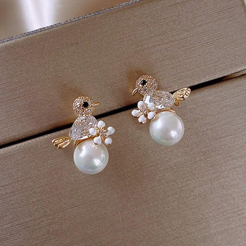 Luxurious Birdie Earrings with Cubic Zirconia and Pearl Accents Jula Jewelry