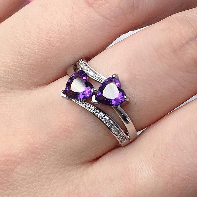 Elegant ring featuring a purple crystal set in silver. Jula Jewelry