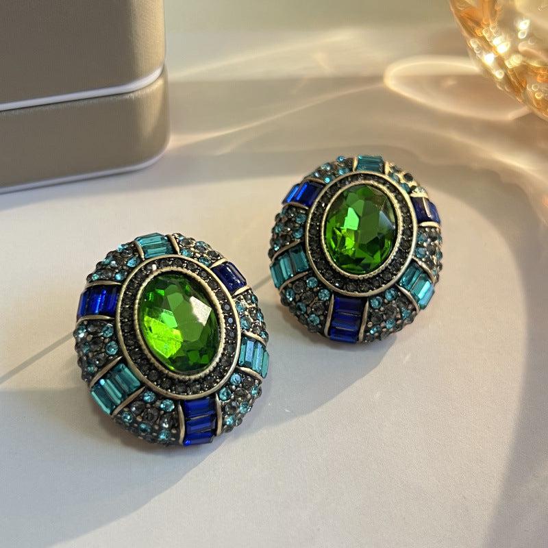 Vintage earrings featuring green crystal and blue cubic zirconia Jula Jewelry