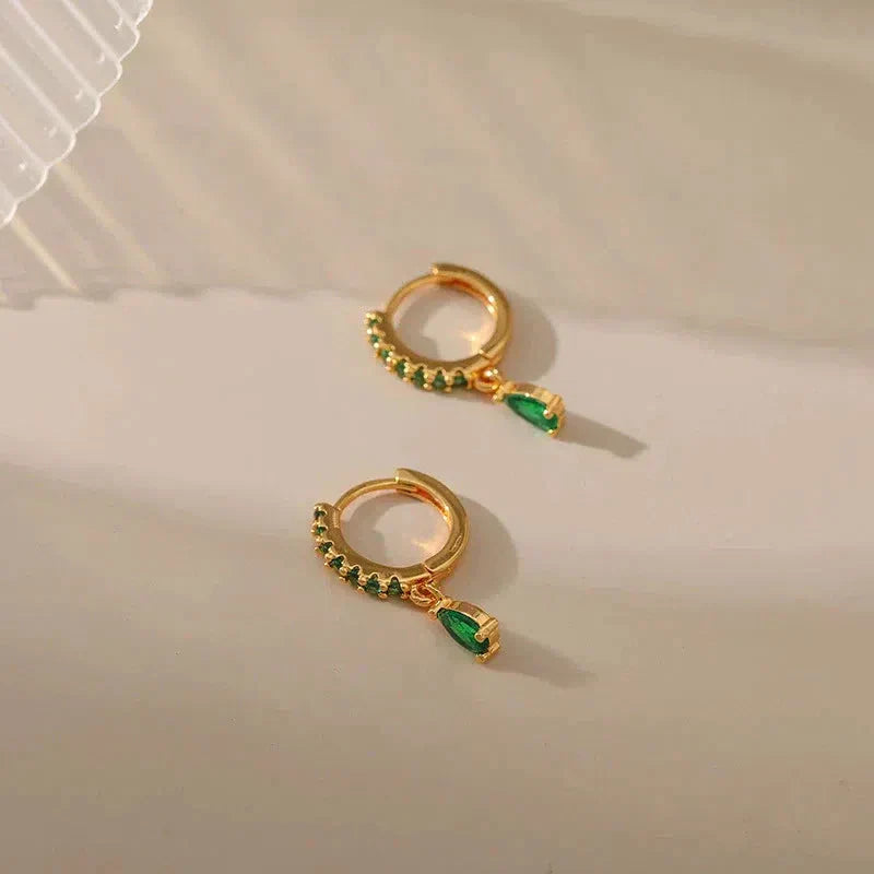 Gold earrings with emerald and zirconia. Jula Jewelry