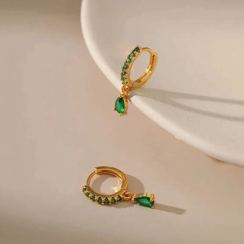 Gold earrings with emerald and zirconia. Jula Jewelry