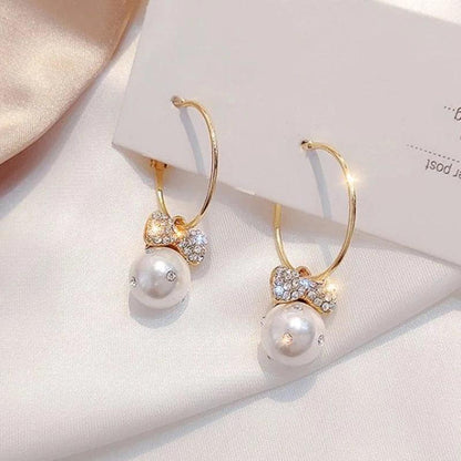 Shiny Gold Earrings Adorned with Pearls Jula Jewelry