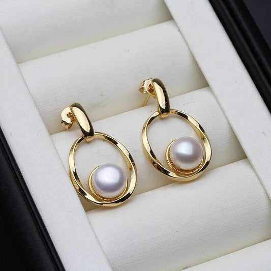 Elegant earrings crafted from gold and pearls Jula Jewelry
