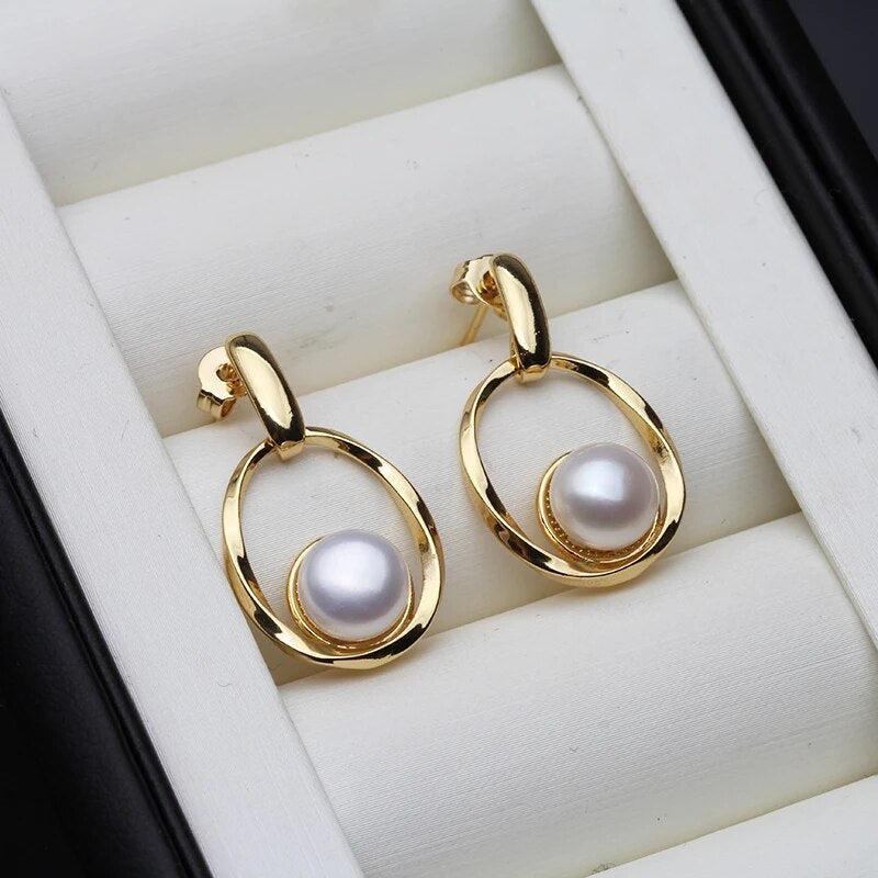 Elegant earrings crafted from gold and pearls Jula Jewelry