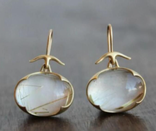 Vintage earrings featuring green moonstone. Jula Jewelry