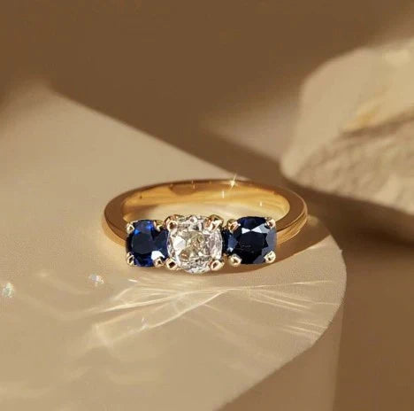 1+1 Offer: Golden Three Stone Cushion Cut White & Blue Sapphire Wedding Band Ring for Women + Round Cut White Sapphire Gold Pendant Necklace Jula Jewelry