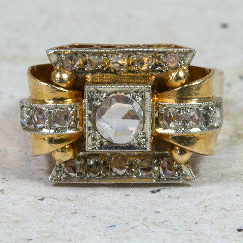 Vintage-style gold ring with a white gemstone. Jula Jewelry