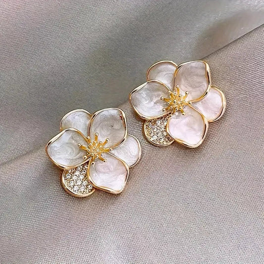 Delicate silver earrings featuring floral accents Jula Jewelry