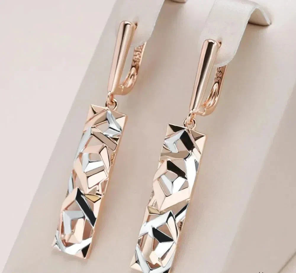 Elegant rectangular earrings in gold and silver. Jula Jewelry