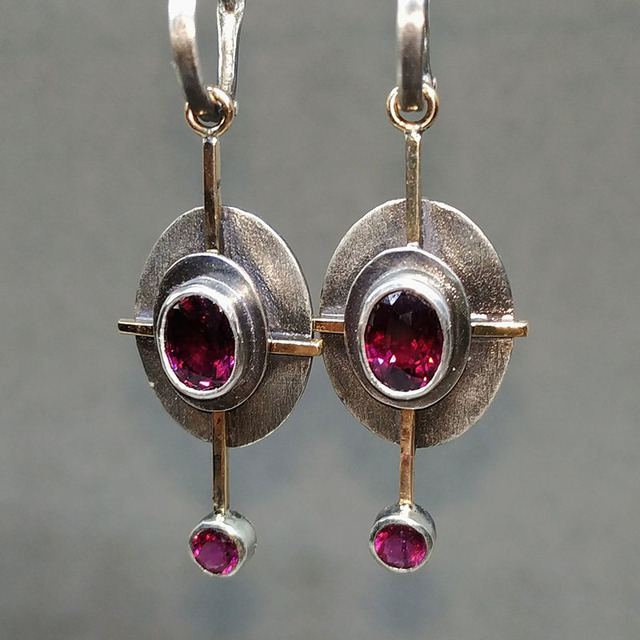 Boho earrings featuring garnet crystal set in sterling silver. Jula Jewelry