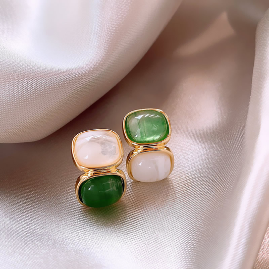 Elegant earrings featuring white and green stones set in gold Jula Jewelry