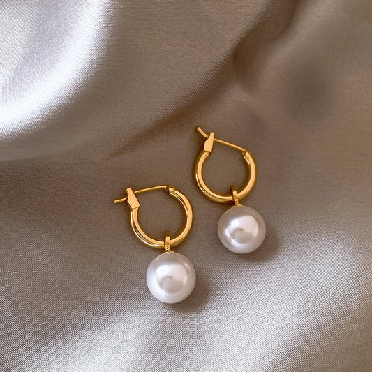 Golden earrings adorned with pearls Jula Jewelry