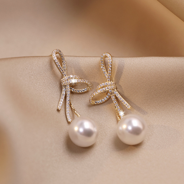 Gold Pearl Earrings with Glossy Bow Jula Jewelry