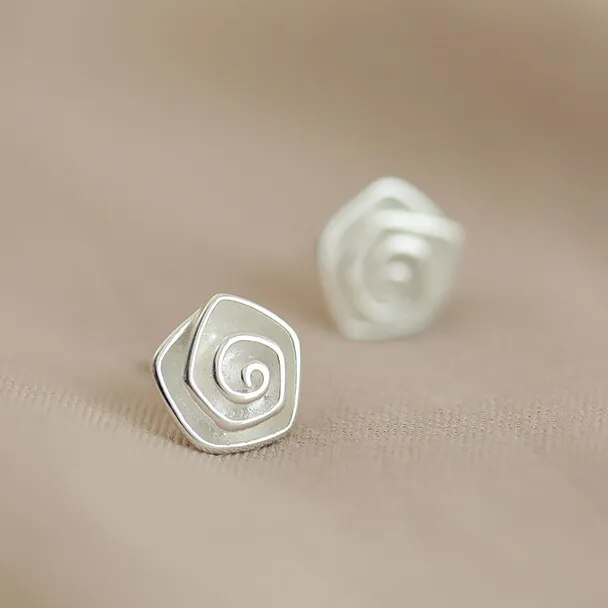 Vintage earrings shaped like a white blossom. Jula Jewelry
