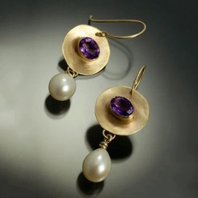 Elegant earrings crafted from pearls and amethyst zirconia. Jula Jewelry