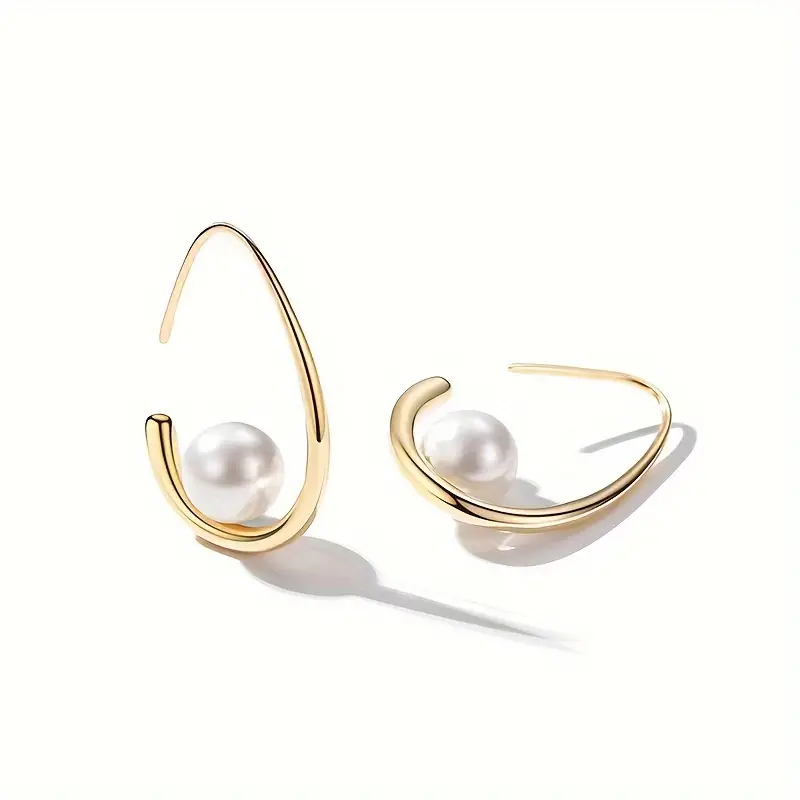 Elegant earrings crafted from pearls and gold. Jula Jewelry
