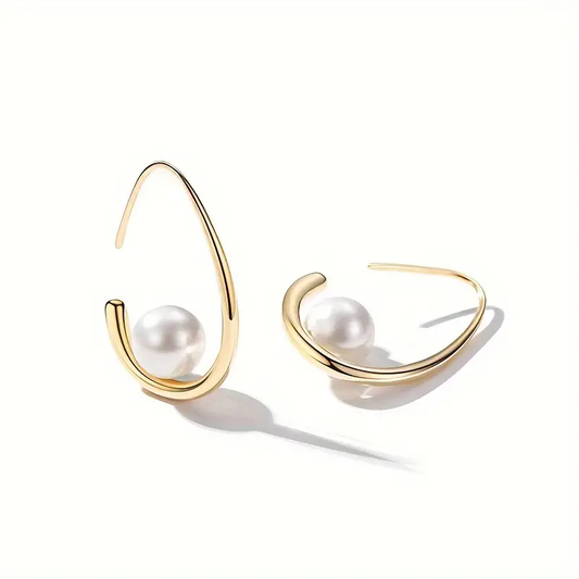 Elegant earrings crafted from pearls and gold. Jula Jewelry