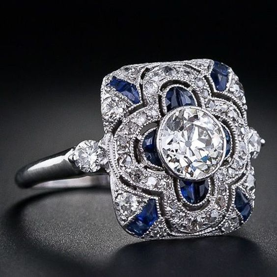 Vintage silver ring featuring a blue zirconia. Jula Jewelry