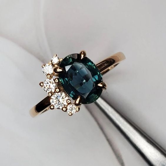 Vintage ring featuring a blue crystal and zirconia. Jula Jewelry