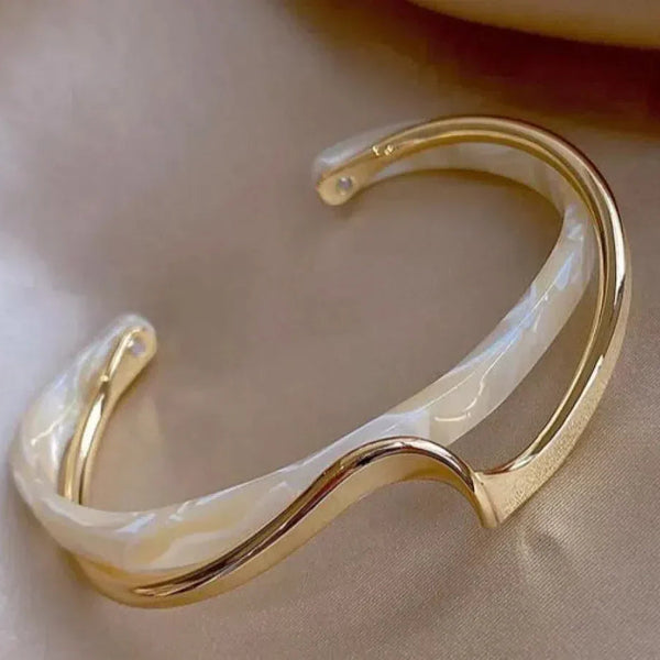 Elegant golden bracelet with white opal accents